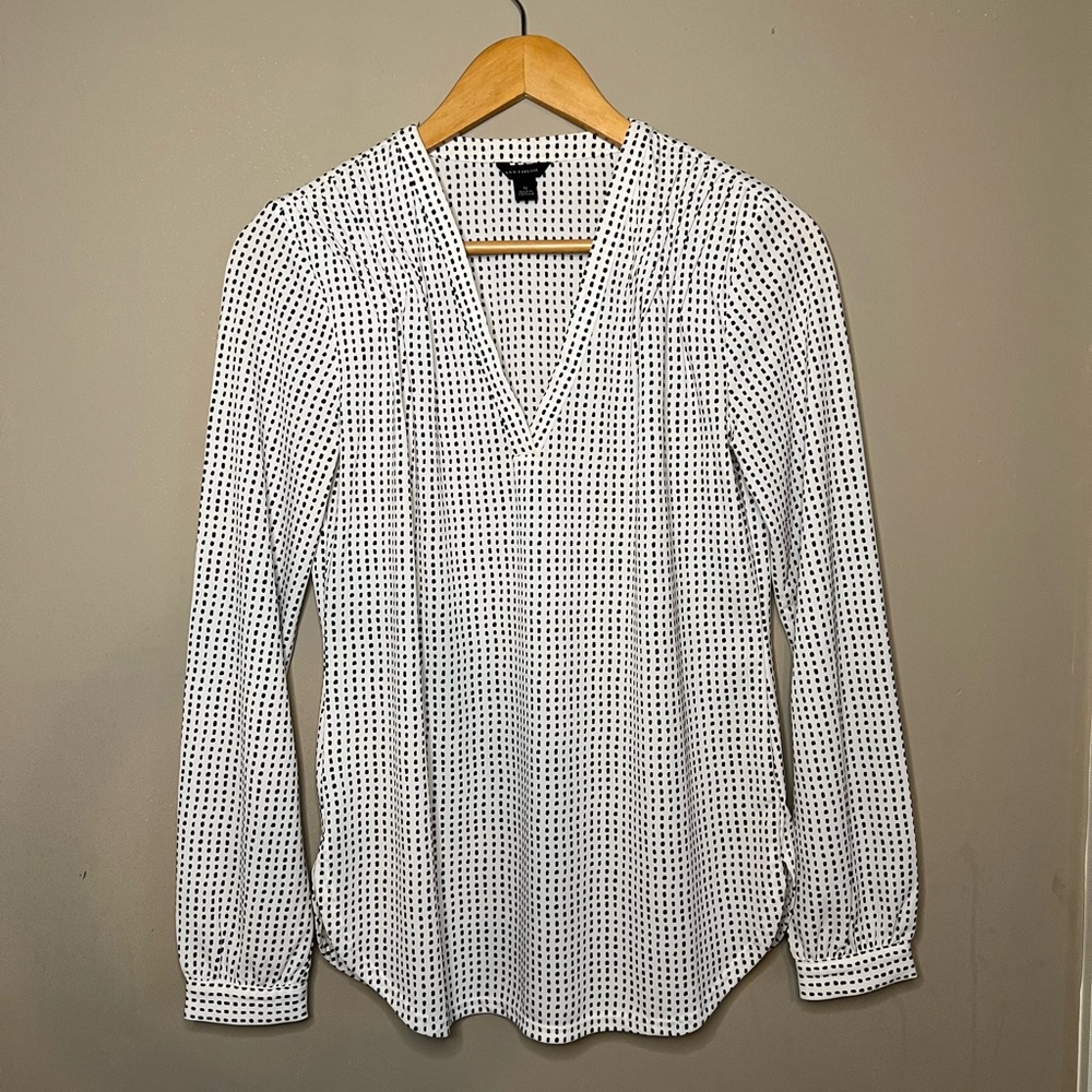 White / black polka dot blouse.